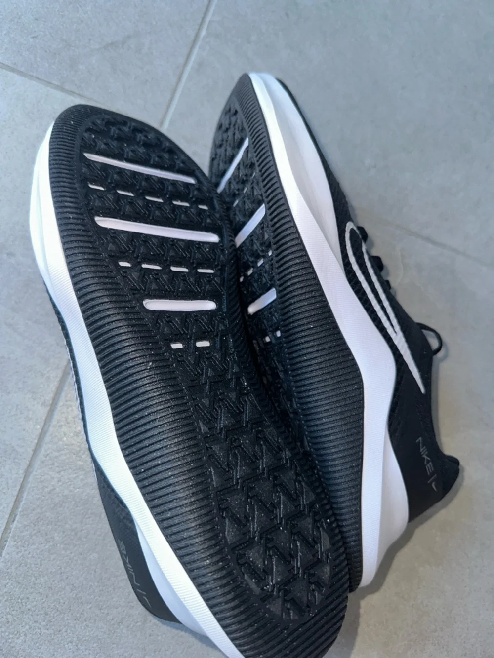Nike Black Athletic Shoes with White Swoosh